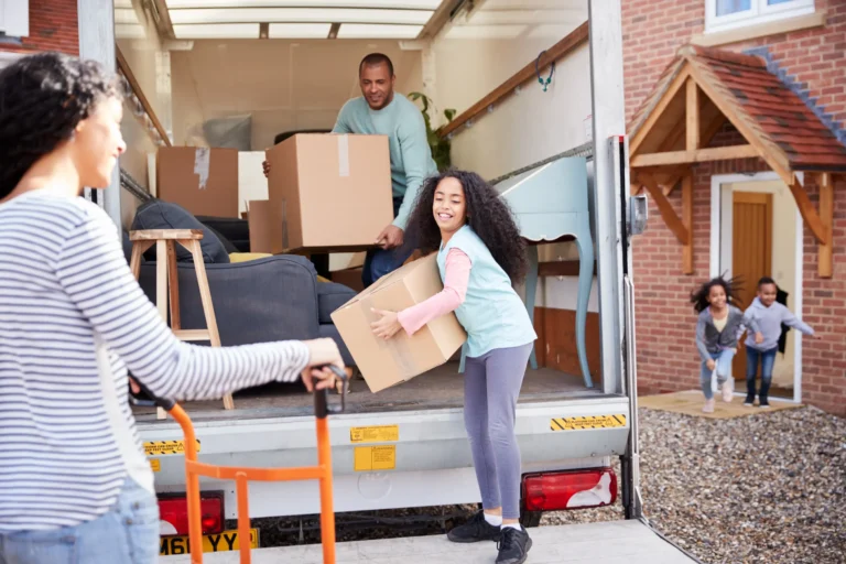 family-unloading-furniture-from-removal-truck-into-2023-11-27-05-31-03-utc